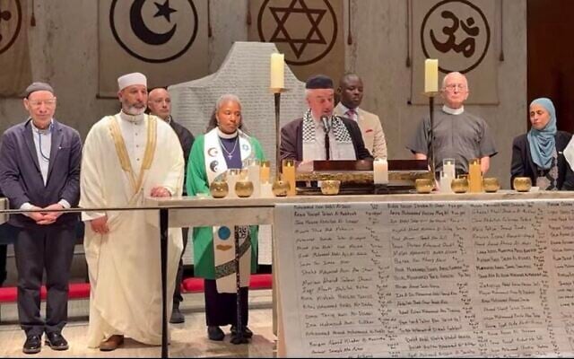 Representatives of an interfaith coalition unveil a shroud with the names of 20,000 Gazan children killed in the Israel-Hamas war, September 18, 2026. (Justice For All)