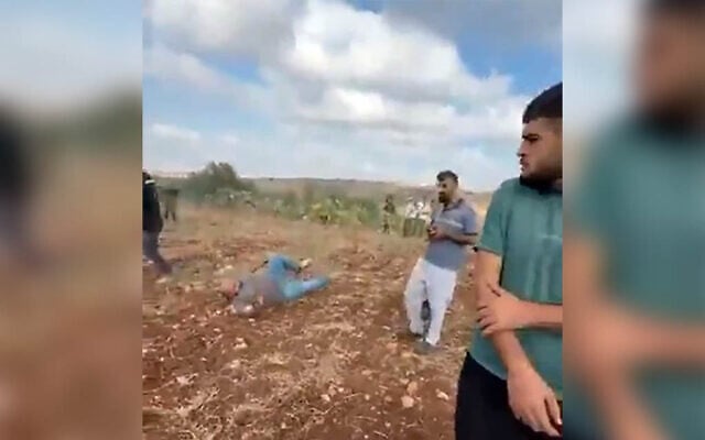 A man lies on the ground after he was shot in the leg by an IDF soldier on the outskirts of the Palestinian village of Faqoua, near Jenin, September 12, 2026 (Screen grab/used in accordance with Clause 27a of the Copyright Law)