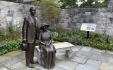Statues of Henry and Clara Ford look over the garden at their historic Fair Lane home in Dearborn, Michigan, September 2, 2026. (Andrew Lapin/JTA)