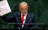 Prime Minister Benjamin Netanyahu holds a Starlink device during the 81st session of the United Nations General Assembly at United Nations headquarters, September 24, 2026. (Screenshot/United Nations via YouTube)