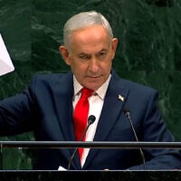 Prime Minister Benjamin Netanyahu holds a Starlink device during the 81st session of the United Nations General Assembly at United Nations headquarters, September 24, 2026. (Screenshot/United Nations via YouTube)