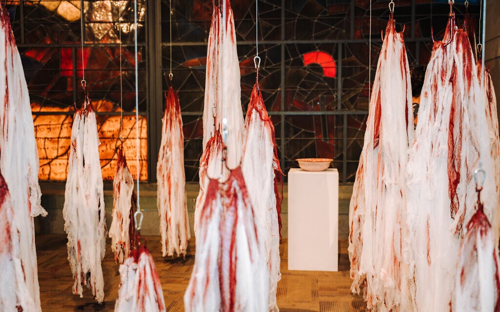 Ariana Litman's incantation bowl and gauze scarves stained red at the Jerusalem Biennale art event on September 24, 2026 (Yacov Buta)