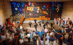 Ronen Itzhaki dance troupe performs at opening of 2026 Jerusalem Biennale art exhibit in front of Ardon Windows at the former National Library of Israel building on Givat Ram campus, with Arik Weiss staircase on the left, September 24, 2026 (Yacov Buta)