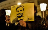 Activists hold a picture of murdered Italian student Giulio Regeni in a demonstration in front of Montecitorio, the Italian Parliament, in Rome on January 25, 2017. (ANDREAS SOLARO/AF/File)
