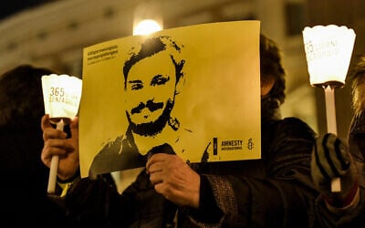 Activists hold a picture of murdered Italian student Giulio Regeni in a demonstration in front of Montecitorio, the Italian Parliament, in Rome on January 25, 2017. (ANDREAS SOLARO/AF/File)