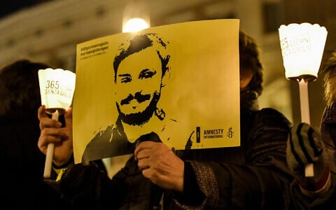 Activists hold a picture of murdered Italian student Giulio Regeni in a demonstration in front of Montecitorio, the Italian Parliament, in Rome on January 25, 2017. (ANDREAS SOLARO/AF/File)