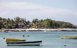 Beachgoers and tourists enjoy the sea near a private resort in Trou d’Eau Douce, Mauritius on January 7, 2024. (Gianluigi Guercia/AFP)