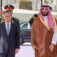 A handout picture provided by the Saudi Press Agency (SPA) shows Saudi Crown Prince Mohammed bin Salman (right) welcoming Chinese Prime Minister Li Qiang in Riyadh, on September 11, 2024. (SPA/AFP) A handout picture provided by the Saudi Press Agency (SPA) shows Saudi Crown Prince Mohammed bin Salman (right) welcoming Chinese Prime Minister Li Qiang in Riyadh, on September 11, 2024. (SPA/AFP)