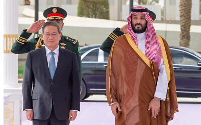 A handout picture provided by the Saudi Press Agency (SPA) shows Saudi Crown Prince Mohammed bin Salman (right) welcoming Chinese Prime Minister Li Qiang in Riyadh, on September 11, 2024. (SPA/AFP) A handout picture provided by the Saudi Press Agency (SPA) shows Saudi Crown Prince Mohammed bin Salman (right) welcoming Chinese Prime Minister Li Qiang in Riyadh, on September 11, 2024. (SPA/AFP)