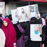 Women hold portraits of detained Islamists held in Roumieh prison during a protest calling for their release in the northern Lebanese port city of Tripoli on January 5, 2025. (Ibrahim Chalhoub/AFP)