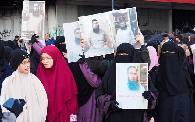 Women hold portraits of detained Islamists held in Roumieh prison during a protest calling for their release in the northern Lebanese port city of Tripoli on January 5, 2025. (Ibrahim Chalhoub/AFP) Women hold portraits of detained Islamists held in Roumieh prison during a protest calling for their release in the northern Lebanese port city of Tripoli on January 5, 2025. (Ibrahim Chalhoub/AFP)