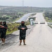 Illustrative: Syrian security personnel officers guard the road on the outskirts of Sweida, southern Syria on February 26, 2026. (LOUAI BESHARA/AFP)