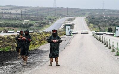 Illustrative: Syrian security personnel officers guard the road on the outskirts of Sweida, southern Syria on February 26, 2026. (LOUAI BESHARA/AFP)