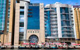 The head offices of Iran’s Bank Melli in Dubai’s Deira district are pictured on March 9, 2026. (AFP)