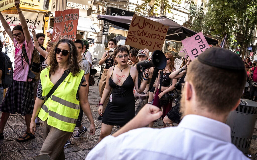A man shouts at demonstrators holding up placards and chanting during the annual ‘SlutWalk’, against firearms in public and private spaces and against the rape culture and violence against women, in Jerusalem on September 4, 2026. (JOHN WESSELS/AFP) A man shouts at demonstrators holding up placards and chanting during the annual ‘SlutWalk’, against firearms in public and private spaces and against the rape culture and violence against women, in Jerusalem on September 4, 2026. (JOHN WESSELS/AFP)