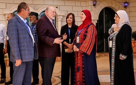 US Ambassador to Israel Mike Huckabee (second from left) is greeted by members of the local municipality as he arrives to visit the home of a Palestinian-American resident who has previously been attacked twice and says he faces ongoing harassment from Israeli settlers, in the Israeli-West Bank town of Turmus Ayya, on September 5, 2026. (John Wessels/AFP)