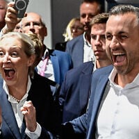 Ulrich Siegmund, the main candidate for the far-right Alternative for Germany at the Saxony-Anhalt state election, and AfD co-leader Alice Weidel celebrate after exit polls following Saxony-Anhalt’s state elections at the fairgrounds in Magdeburg, eastern Germany, on September 6, 2026. (Tobias Schwarz/AFP)