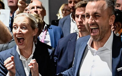 Ulrich Siegmund, the main candidate for the far-right Alternative for Germany at the Saxony-Anhalt state election, and AfD co-leader Alice Weidel celebrate after exit polls following Saxony-Anhalt’s state elections at the fairgrounds in Magdeburg, eastern Germany, on September 6, 2026. (Tobias Schwarz/AFP) Ulrich Siegmund, the main candidate for the far-right Alternative for Germany at the Saxony-Anhalt state election, and AfD co-leader Alice Weidel celebrate after exit polls following Saxony-Anhalt’s state elections at the fairgrounds in Magdeburg, eastern Germany, on September 6, 2026. (Tobias Schwarz/AFP)