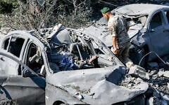 A Lebanese army soldier inspects destroyed vehicles at the site of an overnight Israeli airstrike on the village of Kfar Roummane in southern Lebanon on September 7, 2026. (MAHMOUD ZAYYAT/AFP)