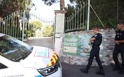 Police officers patrol in front of the entrance of the Musee Renoir after four paintings, valued at $10 million, were stolen from the museum in an early-morning break-in, with the two suspects still at large, in Cagnes-sur-Mer on September 8, 2026. (Valery HACHE/AFP)