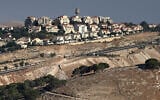 This photograph taken from the E1 corridor, an area in the West Bank shows vehicles driving along the highway near the Israeli settlement of Maale Adumim, on September 8, 2026. (Ahmad GHARABLI/AFP)