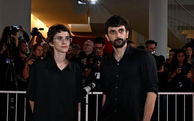 Filmmakers Rachel Szor, left, and Yuval Abraham attend a red carpet event for the screening of 'NAZA' at the 83rd International Venice Film Festival, in Venice Lido, Italy, on September 10, 2026. (Tiziana FABI/AFP)