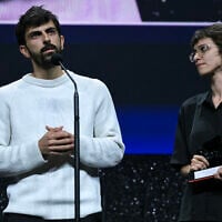 Israeli journalist Yuval Abraham, left, speaks as he and his co-director Rachel Szor accept the Special Jury Prize for 'NAZA' during the closing ceremony of the 83rd Venice Film Festival at Venice Lido, Italy, on September 12, 2026. (Stefano Rellandini/AFP)