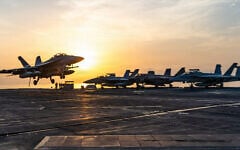 This handout picture released by the US Navy on September 13, 2026, shows an F/A-18 Super Hornet, attached to Strike Fighter Squadron (VFA) 102, landing aboard Nimitz-class aircraft carrier USS George Washington (CVN 73) on September 13, 2026. (Navy Office of Information/AFP)