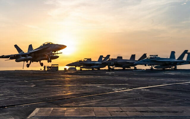 This handout picture released by the US Navy on September 13, 2026, shows an F/A-18 Super Hornet, attached to Strike Fighter Squadron (VFA) 102, landing aboard Nimitz-class aircraft carrier USS George Washington (CVN 73) on September 13, 2026. (Navy Office of Information/AFP)