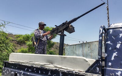 A member of the Saudi-backed Yemeni government forces, including National Army and Taiz Axis forces, mans a turret mounted on the back of a pickup truck at a checkpoint along the Kadha frontline west of Taiz in western Yemen, on September 13, 2026. (AFP) A member of the Saudi-backed Yemeni government forces, including National Army and Taiz Axis forces, mans a turret mounted on the back of a pickup truck at a checkpoint along the Kadha frontline west of Taiz in western Yemen, on September 13, 2026. (AFP)