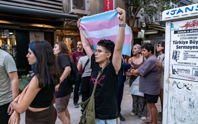 A protester holds a transgender flag during a demonstration against the arrests of LGBTQ activists in Izmir, on September 14, 2026. (Murat Kocabas/AFP)