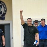 Former spokesman of Greek ultra-nationalist party Golden Dawn, Ilias Kasidiaris puts his fist in the air as he greets supporters after his release from high security Domokos prison in central Greece on September 15, 2026. (Aris MESSINIS/AFP)