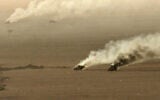 This handout picture released on September 15, 2026, by the Houthi Ansarullah Media Center reportedly shows burning military vehicles that they targeted in Saudi Arabia's al-Jawf. (ANSARULLAH MEDIA CENTER/AFP)