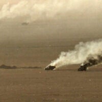 This handout picture released on September 15, 2026, by the Houthi Ansarullah Media Center reportedly shows burning military vehicles that they targeted in Saudi Arabia's al-Jawf. (ANSARULLAH MEDIA CENTER/AFP)