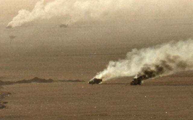 This handout picture released on September 15, 2026, by the Houthi Ansarullah Media Center reportedly shows burning military vehicles that they targeted in Saudi Arabia's al-Jawf. (ANSARULLAH MEDIA CENTER/AFP)