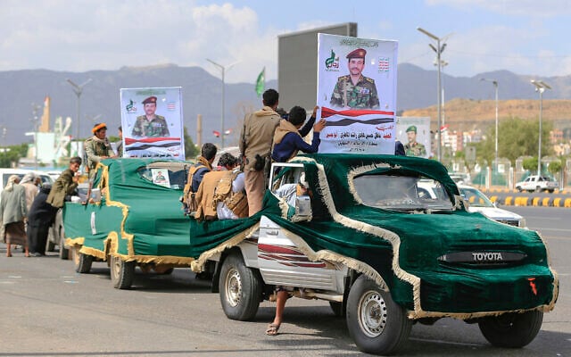 Pickup trucks with portraits of a fighter loyal to the Houthi authorities drive past during his funeral after he was killed in recent fighting, in Yemen’s capital Sanaa on September 17, 2026. (Mohammed HUWAIS/AFP)