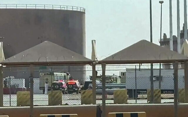 In this frame grab taken from AFPTV video footage on September 19, 2026, fire trucks and police vehicles are seen at the scene of a fire at the Aramco fuel depot near King Khalid International Airport in Riyadh. (AFPTV/AFP)