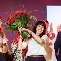 The Die Linke (Left Party’s) main candidate Elif Eralp celebrates on stage following exit polls in Berlin’s state elections in Festsaal Kreuzberg in Berlin on September 20, 2026. (Jens SCHLUETER/AFP)