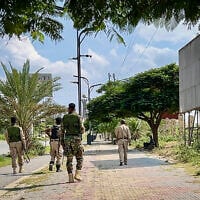 Members of the Tigray People’s Liberation Front (TPLF) walk along a main road in Mekelle on September 23, 2026, as tensions intensify in northern Ethiopia after Tigrayan rebels seized control of airports in the region. (AFP)