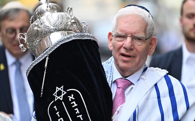 The President of the Central Council of Jews in Germany, Josef Schuster, carries the Torah scroll during the inauguration ceremony of the rooms of the first military rabbinate of the German Armed Forces Bundeswehr in Berlin, Germany, on July 4, 2024. (RALF HIRSCHBERGER/AFP/File) The President of the Central Council of Jews in Germany, Josef Schuster, carries the Torah scroll during the inauguration ceremony of the rooms of the first military rabbinate of the German Armed Forces Bundeswehr in Berlin, Germany, on July 4, 2024. (RALF HIRSCHBERGER/AFP/File)