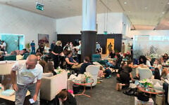 In this handout picture taken and obtained on September 30, 2026, passengers of the flydubai flight FZ1073 from Dubai to Tel Aviv are seen inside the Prince Sultan bin Abdulaziz Airport in Tabuk, after their plane was forced to land in Saudi Arabia due to an alleged attempt to crash the plane by the first officer. (Courtesy Of An Anonymous Source/AFP)