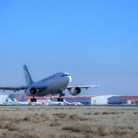 An Iranian Mahan Air plane lands at Tehran's Imam Khomeini International Airport on February 4, 2021. (Saeed Kaari/IKAC via AP)