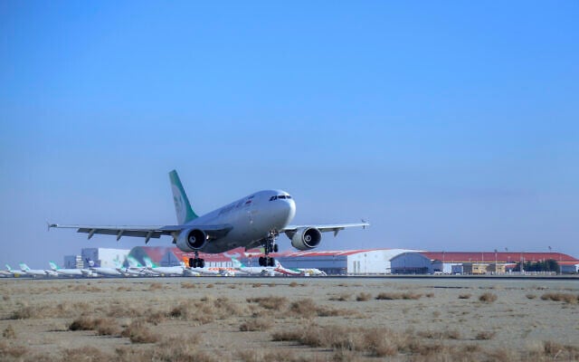 An Iranian Mahan Air plane lands at Tehran's Imam Khomeini International Airport on February 4, 2021. (Saeed Kaari/IKAC via AP)