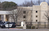 Police gather in front of the Congregation Beth Israel synagogue, January 16, 2022, in Colleyville, Texas, a day after four were taken hostage by a pistol-wielding man during a Shabbat service. (AP Photo/Brandon Wade)