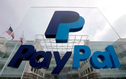 File: A PayPal sign is shown in San Jose, California, March 10, 2015. (AP Photo/Jeff Chiu)
