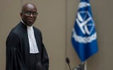 Deputy Prosecutor Mame Mandiaye Niang takes his seat in court for the verdict of Al Hassan Ag Abdoul Aziz Ag Mohamed Ag Mahmoud at the International Criminal Court in The Hague, Netherlands, June 26, 2024. (AP Photo/Peter Dejong, Pool)