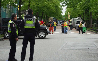 Vancouver Police watch as city workers begin to clear the scene where a driver killed multiple people during a Filipino community festival April 29, 2025, in Vancouver, British Columbia. (AP Photo/Lindsey Wasson) Vancouver Police watch as city workers begin to clear the scene where a driver killed multiple people during a Filipino community festival April 29, 2025, in Vancouver, British Columbia. (AP Photo/Lindsey Wasson)