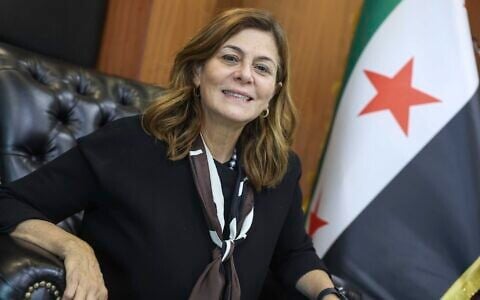 Syrian Minister of Social Affairs and Labor Hind Kabawat, speaks during an interview with the Associated Press, in Damascus, Syria, May 12, 2025. (AP Photo/Ghaith Alsayed)