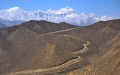 Illustration: A dirt road through barren mountains in Nepal, April 17, 2025. (AP Photo/Niranjan Shrestha)