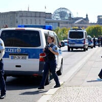Illustrative: Police officers guard a bridge in Berlin, Germany, August 13, 2025. (AP Photo/Ebrahim Noroozi)